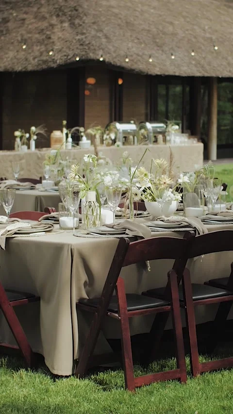 Vertical video. Wedding dining area with elegant table setting in the park on a Stock Footage 311456629