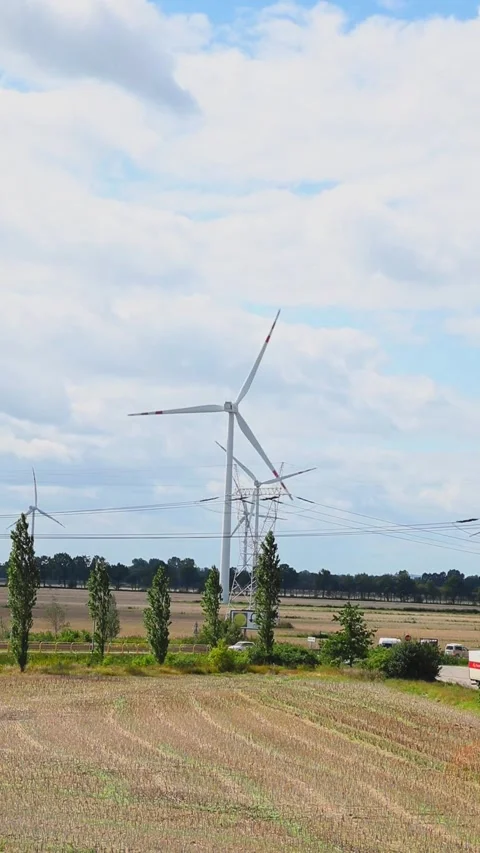A Vertical Video of a Windmill on a Field. Renewable Energy and Eco-Friendl.. Stock Footage 315666780