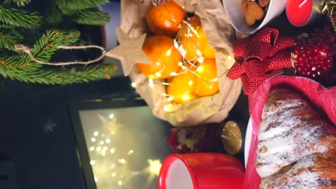 Vertical video. Winter evening table with hot chocolate, bun and tangerines Stock Footage 144238482