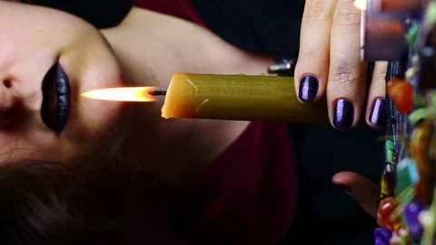 Vertical video, Witch hands performing a magic ritual holding a candle Stock Footage 246540059