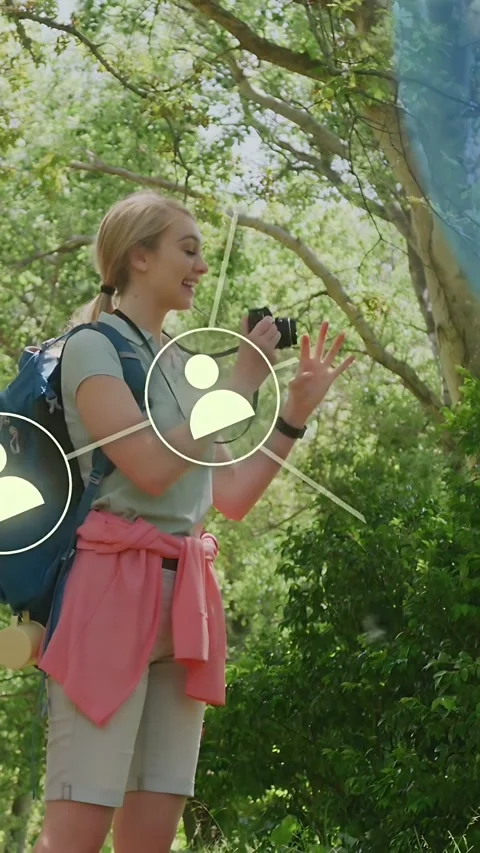 Vertical video: Woman after checking cam raising it for nature pic while node Video stock 333603742