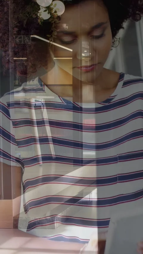 Vertical video: Woman bringing tablet forward and tapping for work, tech Stock Footage 332734992