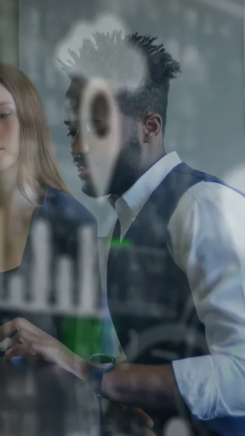 Vertical video: Woman checking tablet, man leaning, using pad, reviewing office Stock Footage 331406083