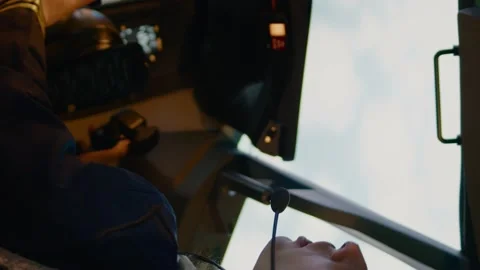 Vertical video: Woman copilot using control panel command in captain cabin Stock Footage 196964808
