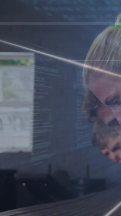 Vertical video: Woman dev leaning, scanning UI, code lines streaming on glass Stock Footage 330305989