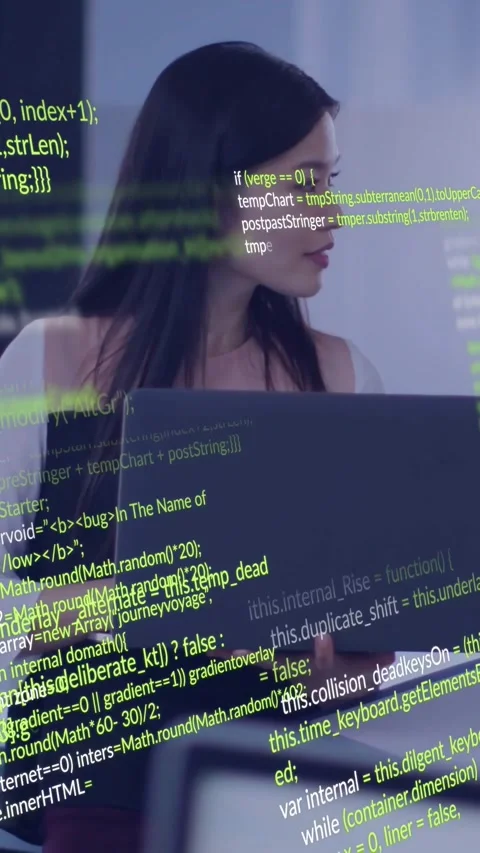Vertical video: Woman dev shifting gaze after peer cue, reviewing code on laptop Stock Footage 334547103