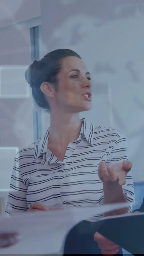 Vertical video: Woman eyeing notes, talking, gesturing as UI overlay framing Stock Footage 334792496