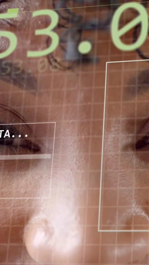 Vertical video: Woman facing camera, system initiating facial scan for ID, HUD Stock Footage 333479948
