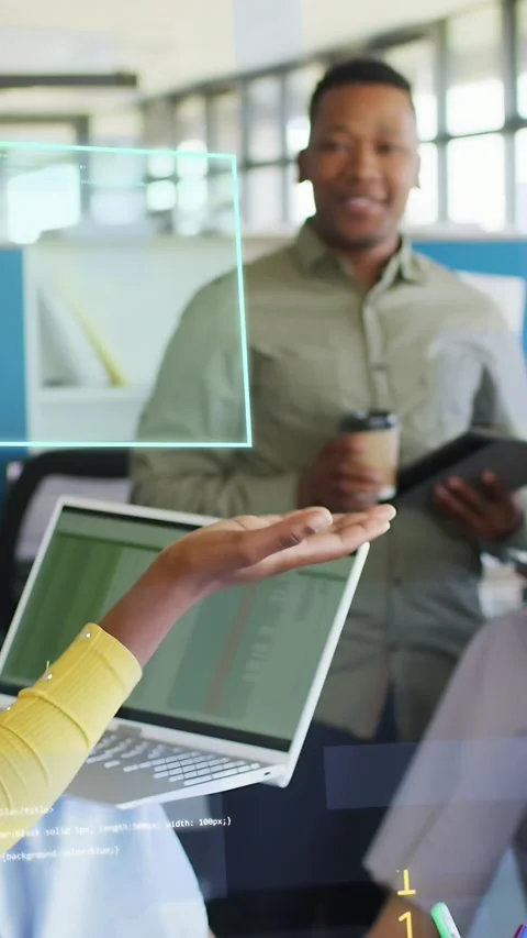 Vertical video: Woman gesturing over laptop, moving AR panels and code while Stock Footage 333977874