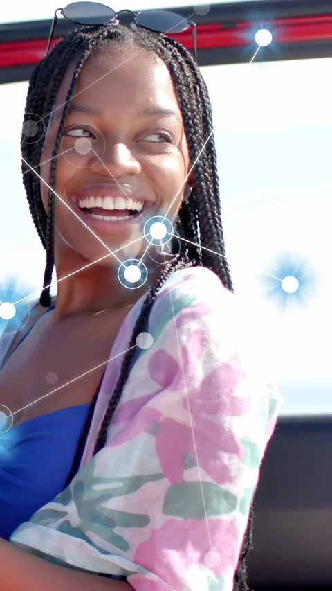 Vertical video: Woman glancing at device, reacting with laugh, tech blue nodes Stock Footage 333236569
