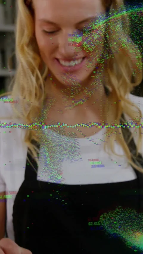 Vertical video: Woman glancing down arranging cupcakes in bakery, glitches Stock Footage 334319326
