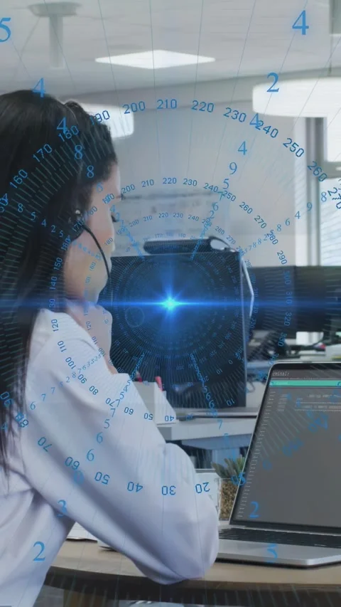 Vertical video: Woman in headset testing code while blue HUD animating and Stock Footage 331009309