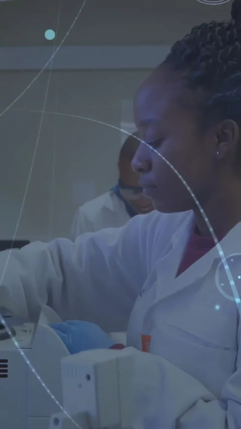 Vertical video: Woman lab tech lifting tube and loading analyzer for sample Stock Footage 331077524