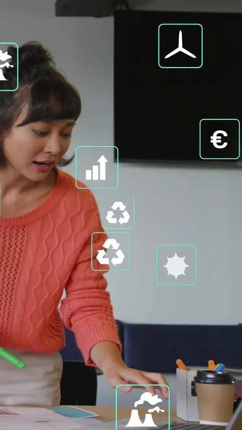 Vertical video: Woman marking docs with green marker, creating CO2 icons, using Stock-Footage 331030550