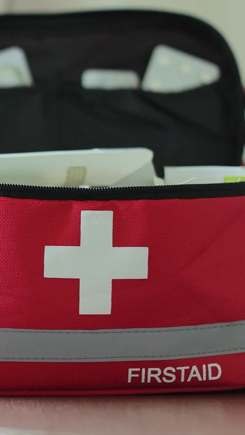 Vertical video Woman open the first aid kit at home. First aid kit. Stock Footage 338082243