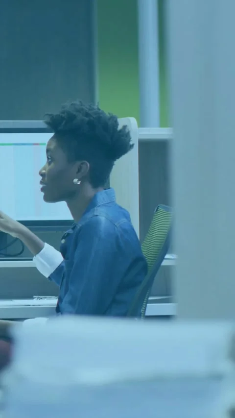 Vertical video: Woman pointing in cubicle, causing data charts expanding on Stock Footage 331128554