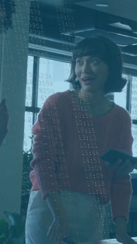 Vertical video: Woman pointing at docs, causing tech data overlay with red bar Stock Footage 331168989