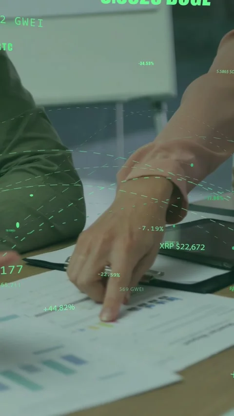 Vertical video: Woman pointing tablet, man tapping charts, AR crypto overlays Stock Footage 335355465