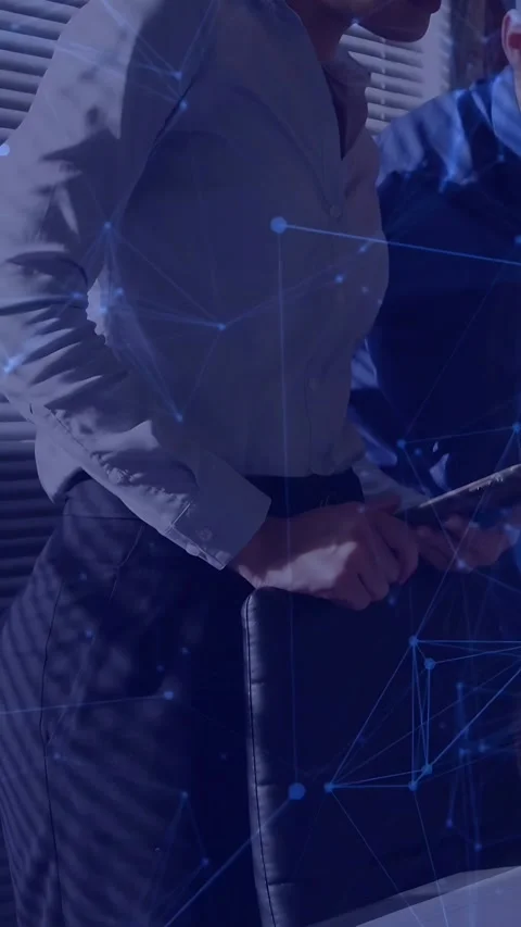 Vertical video: Woman presenting, tapping tablet and showing blue graph overlay Stock Footage 333541826