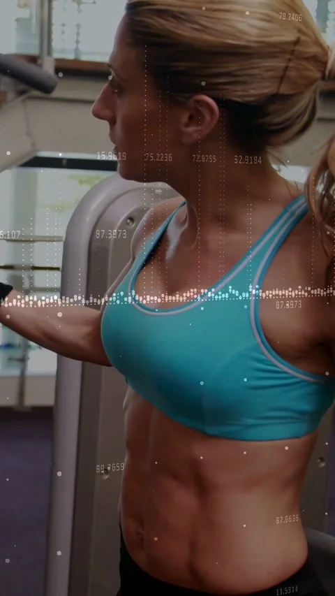Vertical video: Woman reaching handle and pulling cable in gym with wave data Stock Footage 334598997