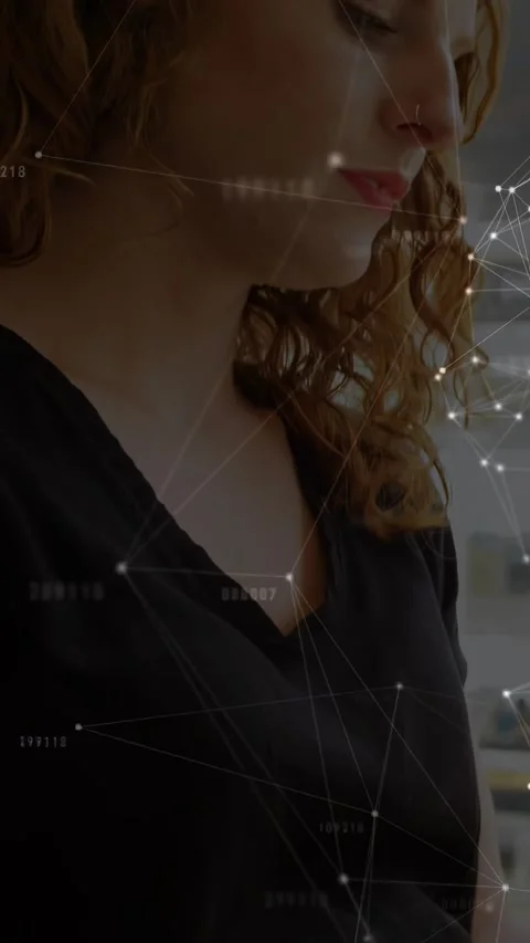 Vertical video: Woman reaching tech mesh overlaying face, zooming, head tilting, Stock Footage 330655360