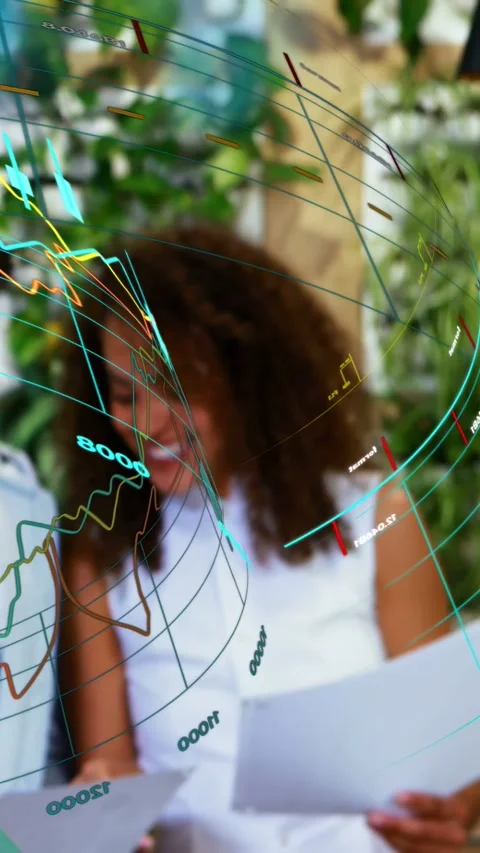 Vertical video: Woman reading docs, peer pointing, AR tech graphs flowing over Stock Footage 340133525
