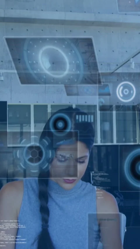 Vertical video: woman reading tablet, causing HUD panels fading in and growing Stock Footage 332984776