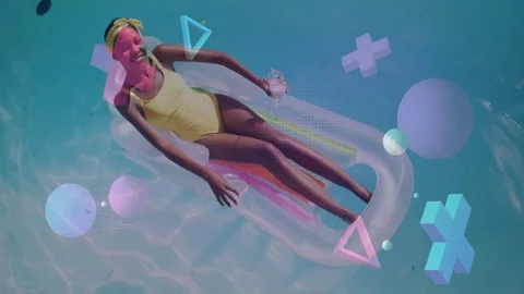 Vertical video: Woman reclining on float raising right arm holding cup while Stock Footage 332772332