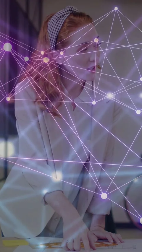 Vertical video: Woman scanning docs, speaking to design team while purple Stock Footage 335355252