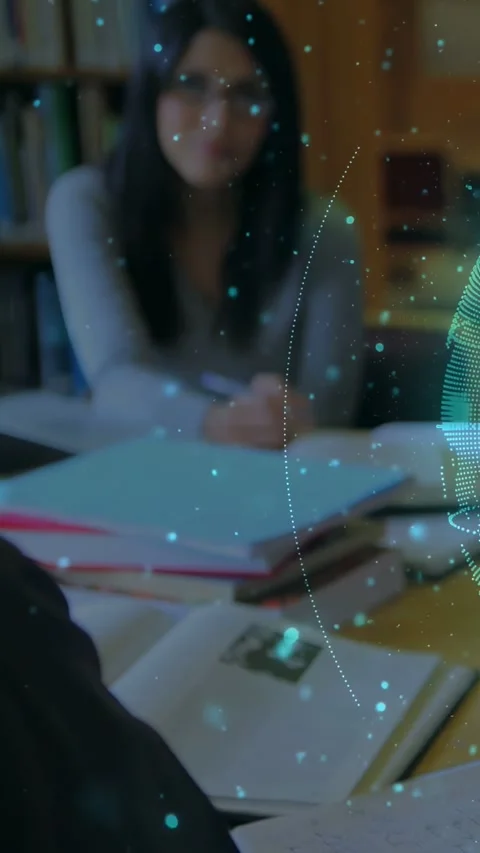 Vertical video: Woman sitting at table with books HUD globe sweeping right Stock Footage 333595850