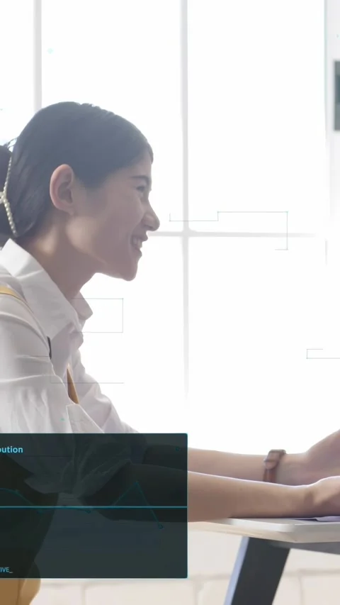Vertical video: Woman speaking in tech meeting, HUD appearing with CPU 42% and Stock Footage 333465451