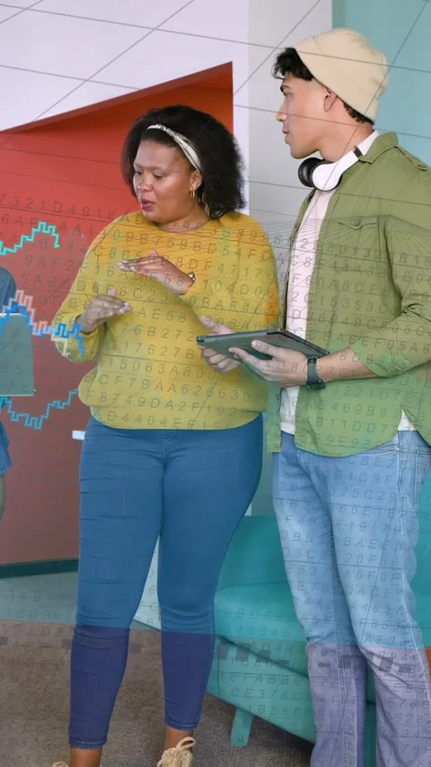 Vertical video: Woman speaking while man tilting tablet in lounge, creating data Stock Footage 334770387