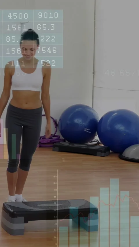 Vertical video: Woman stepping onto step, doing step workout for cardio while Stock Footage 332747680