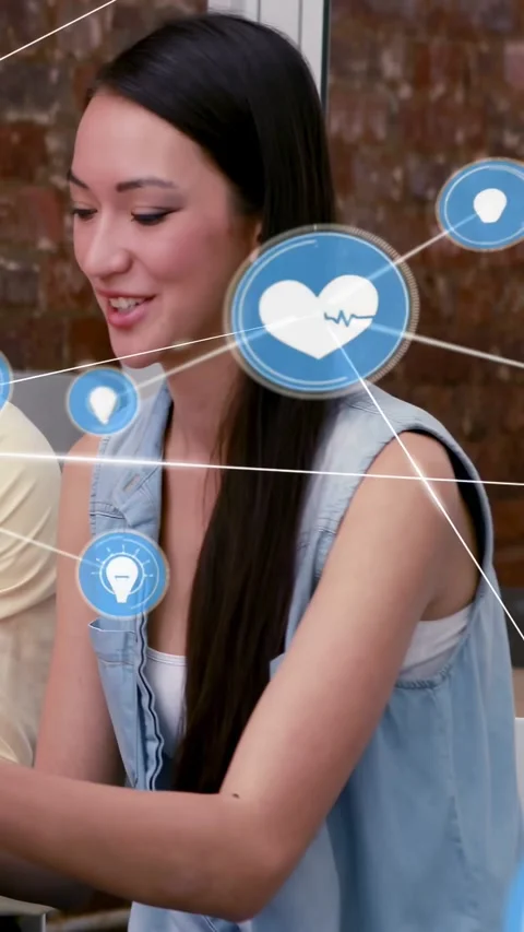 Vertical video: Woman talking in tech meeting, blue nodes appearing, growing Stock Footage 334386767
