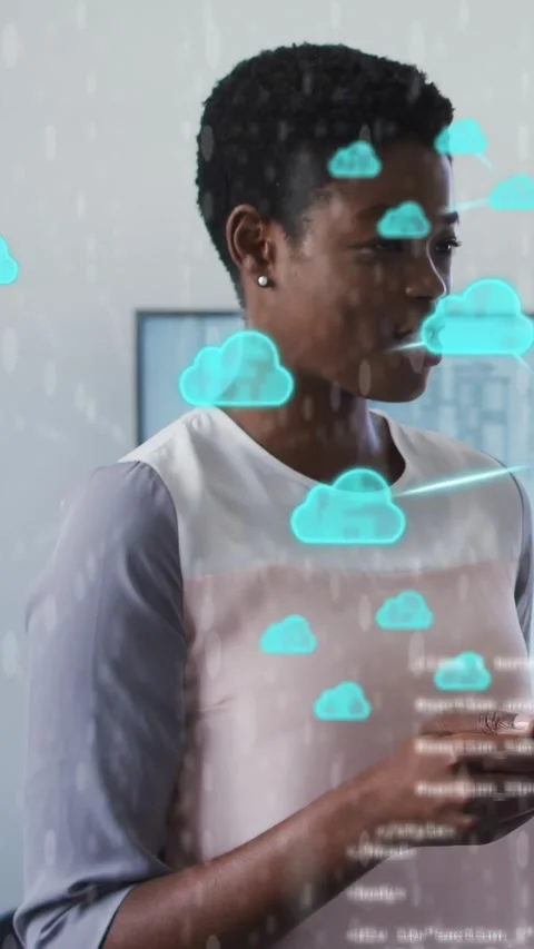 Vertical video: Woman tapping phone in office launching cloud icons and code Stock Footage 334046851