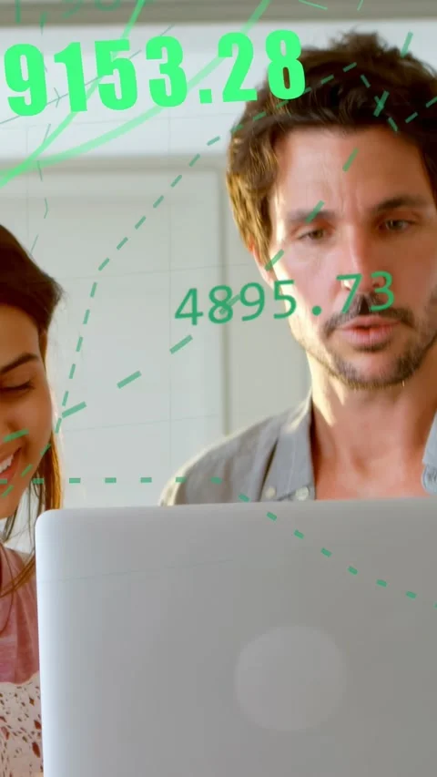 Vertical video: Woman tapping silver laptop, man holding, green hex data rising Stock Footage 333721064