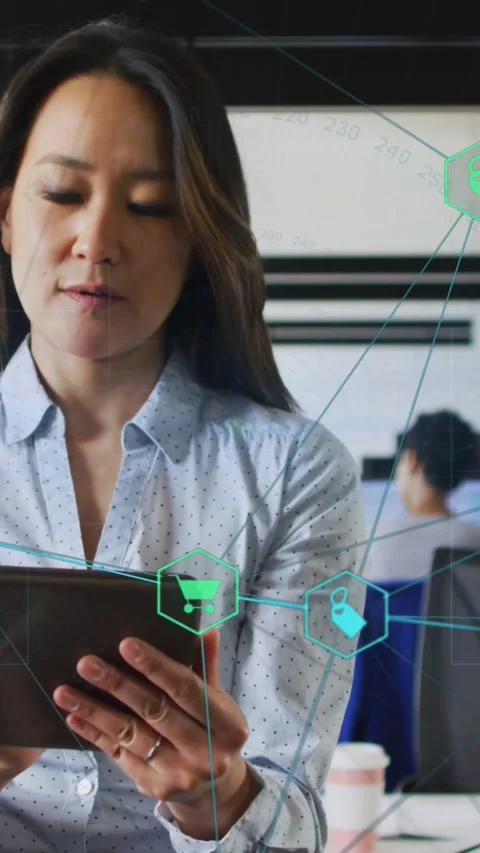 Vertical video: Woman tapping tablet and managing retail data via hexagon HUD in Stock Footage 328350188
