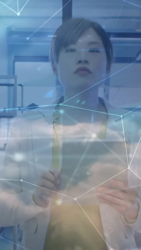 Vertical video: Woman tapping tablet in office, reviewing tech data with cloud Stock Footage 329841033