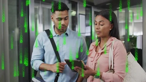 Vertical video: Woman tapping tablet starting green binary rain, team consulting Stock Footage 330462755