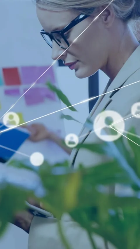 Vertical video: Woman tapping tablet making network icons linking notes, driving Stock Footage 332506863