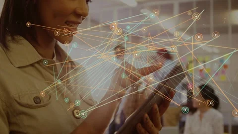 Vertical video: Woman tapping tablet starting node overlay linking device to Stock Footage 333019553