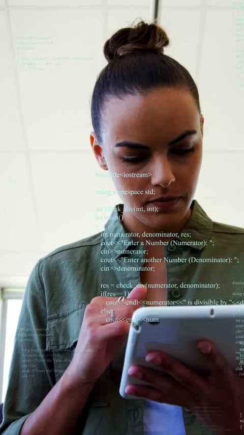 Vertical video: Woman tapping tablet and scrolling, showing code overlay on face Stock Footage 333157727
