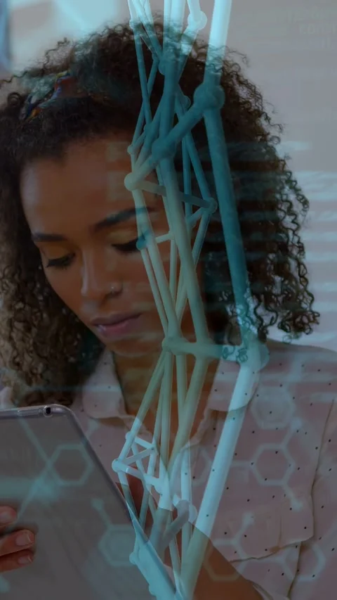 Vertical video: Woman tapping tablet in tech space, AR lattice and code shifting Stock Footage 333259704