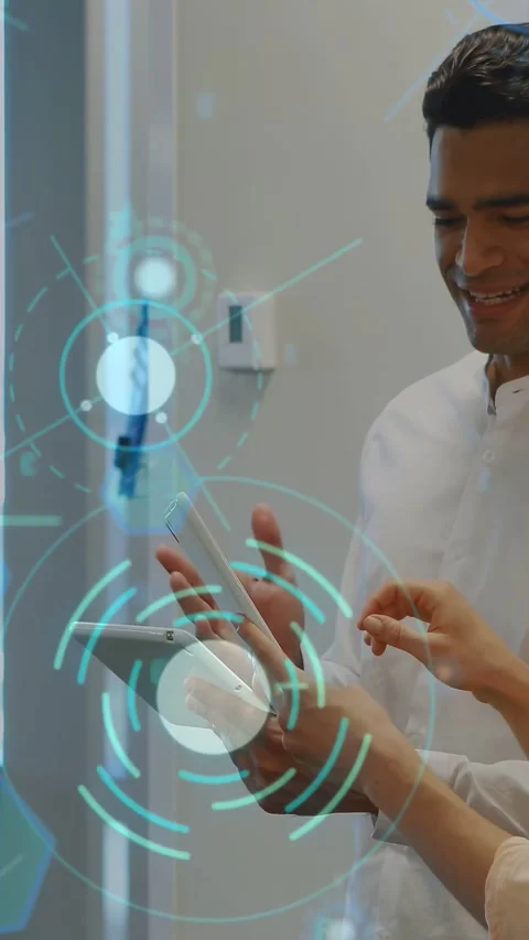 Vertical video: Woman tapping tablet as man holding device, tech HUD reacting Stock Footage 333487251