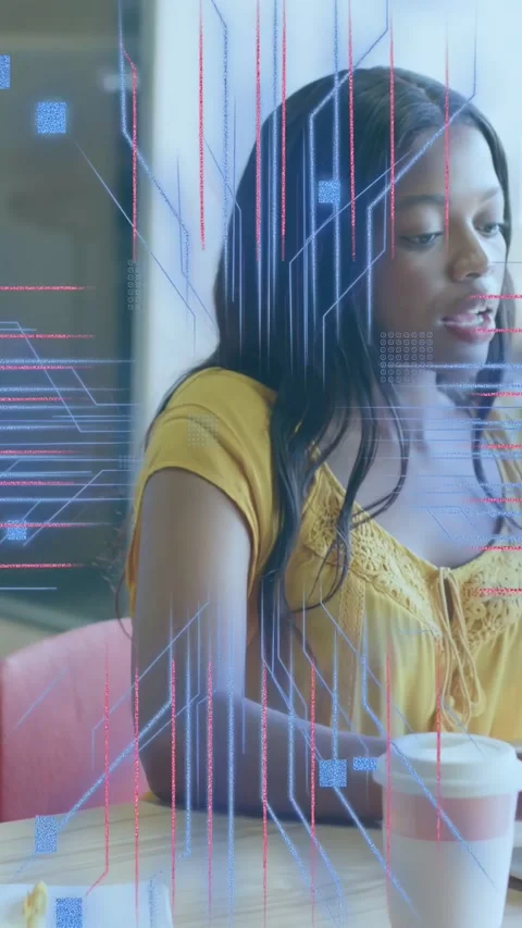 Vertical video: Woman tapping tablet, holding coffee, circuitry and code Stock Footage 333596582