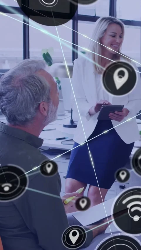 Vertical video: Woman tapping tablet, initiating growing node net as man noting, Video stock 334187569