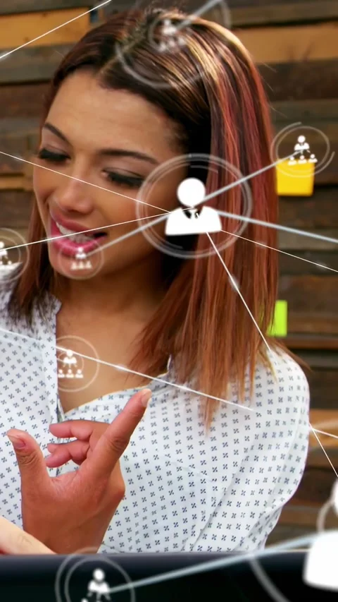 Vertical video: Woman tapping tablet, activating network nodes appearing over Vídeo Stock 334317541