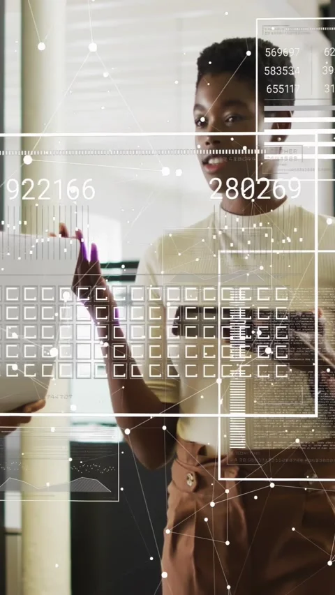 Vertical video: Woman tapping tablet, gesturing as AR overlay mapping numbers Stock Footage 334546816