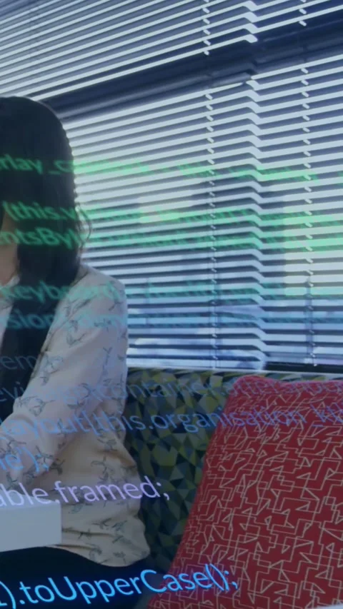 Vertical video: Woman tapping tablet causing green code scrolling on torso and Stock Footage 334605190