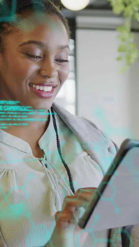 Vertical video: Woman tapping tablet in tech office causing cyan code shifting Vidéo 337540506